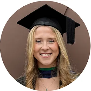 A photograph of Hannah Gapps. She has blonde hair, is smiling, and wears a black graduation cap. The photo only shows her head and shoulders.