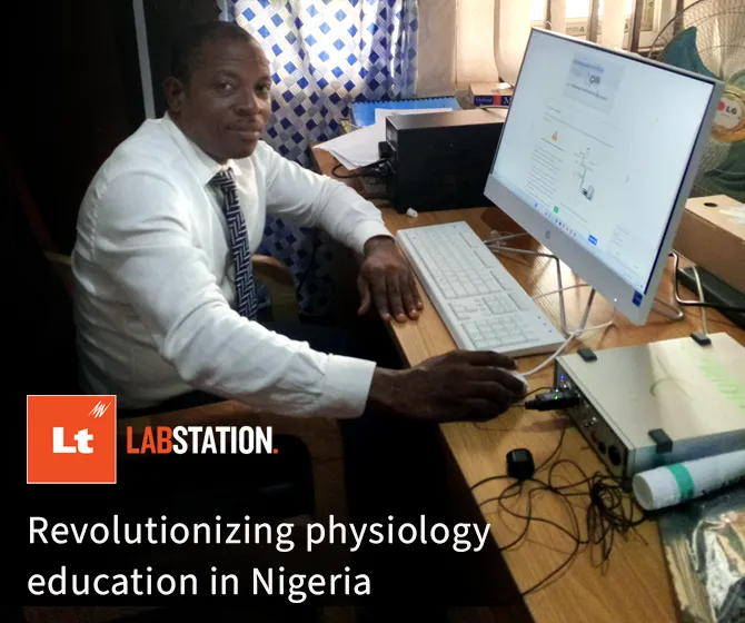 Johnson Olowe sitting at a desk with LabStation open on the computer screen and a PowerLab sitting next to the computer.